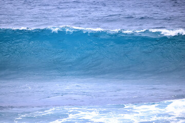 Naklejka na ściany i meble wave in the ocean abstract background, blue sea texture motion