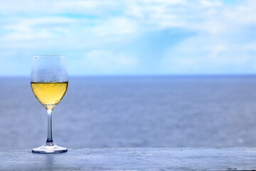 a glass of white wine in a restaurant, alcohol luxury background