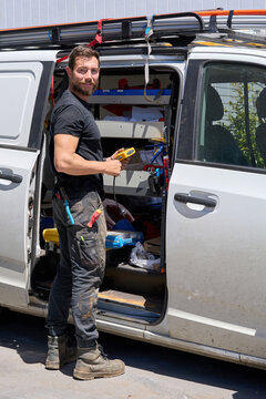 Small business Electrician preparing work van