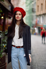 Woman smile fashion model walks on the street in the city center among the crowd in a jacket and red beret and jeans, cinematic french fashion style clothing, travel to istanbul spring