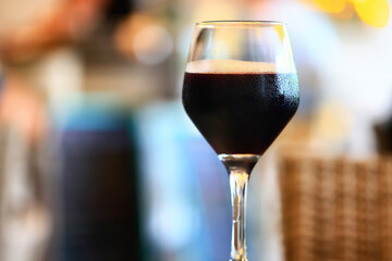 a glass of red wine in a luxurious background restaurant