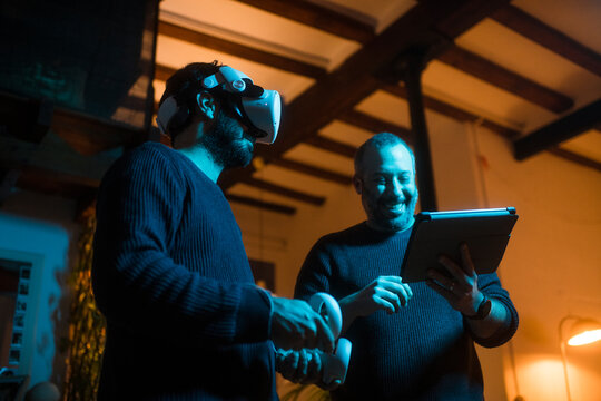 Friends having fun experimenting with VR technology