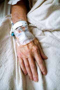 IV Drip in an Older Woman's Hand 
