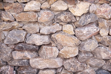 Stone wall background brown texture with seamless overlap patterns