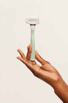 Woman holding a shaving razor