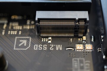 Closeup of an M.2 SSD slot on a Asus TUF Gaming Z790-Plus Wifi motherboard - obrazy, fototapety, plakaty