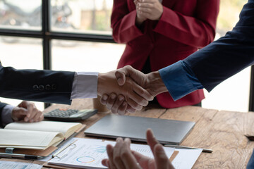 group of business people sitting in a meeting