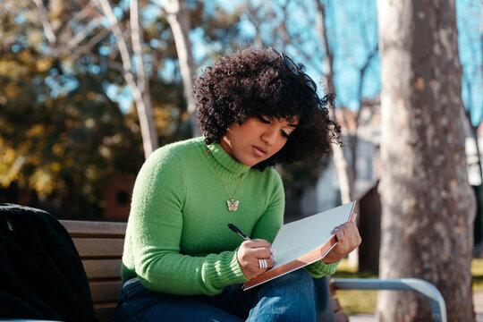 Trans woman journaling on her diary