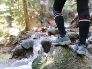 woman hiking alone in the forest