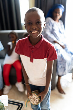 child playing the timbal at a family party at home