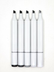set of gray sketch pens or markers with open tips used by designers isolated in a white background