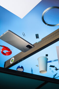 stationary elements unorganised on table.