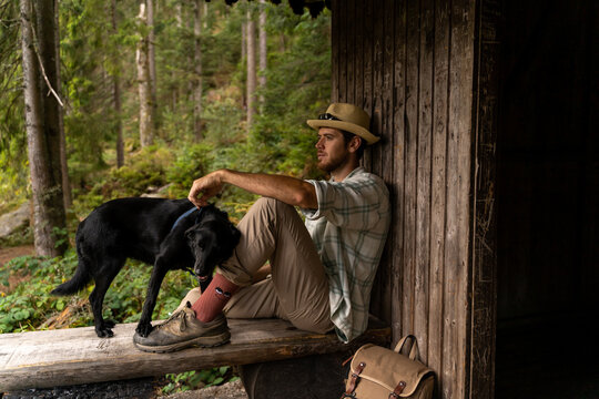 man in forest hut