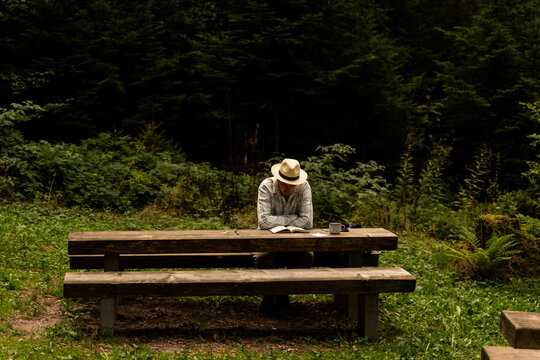camper Man reading book in nature