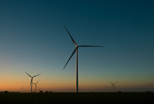 Wind turbines landscape at sunset