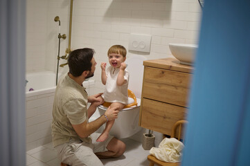 dad and his son in the toilet at home