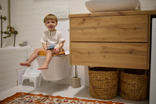 kid on a toilet