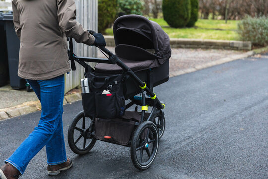 Unrecognizable woman with stroller