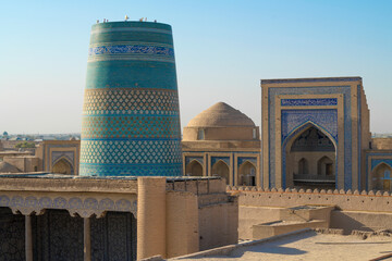 The ancient minaret of Kalta Minor and the portal of Muhammad Amin Khan Madrasah on a sunny...