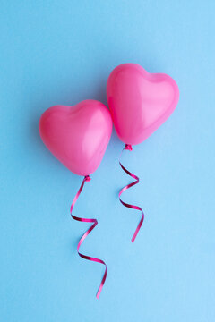 Two pink heart shaped balloons