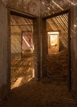 House buried by the desert in Kolmanskop ghost town, Namibia, Africa.