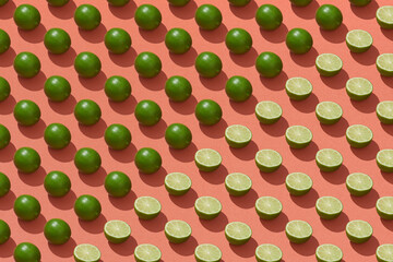 Pattern made with green lemon, lime slice on red background