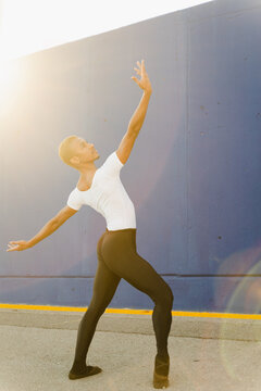 Dancer Dancing In Front Of A Blue Wall