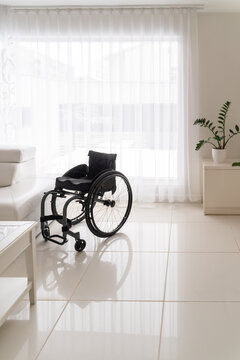 Empty Wheelchair At Bright Home