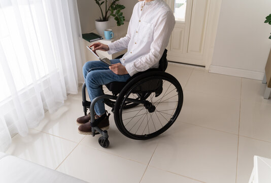 Anonymous Woman With Disability Using Tablet 