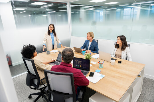 Businesspeople Working in Bright Workspace Office