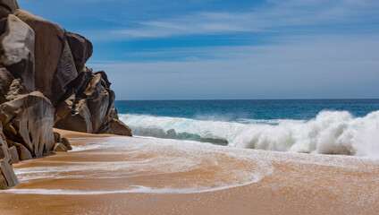 rocky beach seaside with ocean waves. rocky beach seaside in summer.