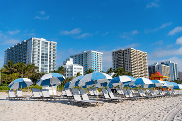 deckchair and umbrellas at summer beach vacation. photo of deckchair at summer beach