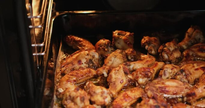 Buffalo Chicken wings cooking in electric oven