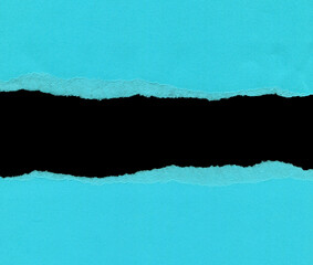 Torn blue paper with space for your message on black background