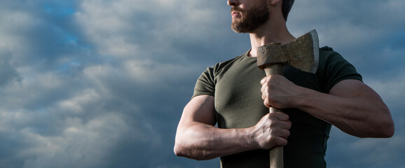strong man with axe. caucasian man hold ax. brutal man on sky background. cropped view