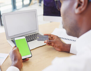 Phone, credit card and black man with green screen for online shopping, advertising or marketing in office. Mockup branding, ecommerce and male with mobile for fintech, payment or digital banking.