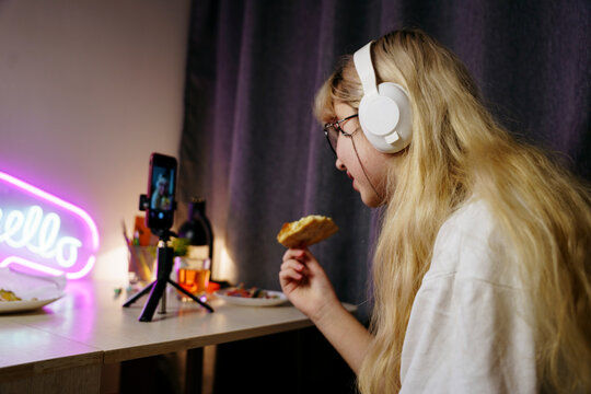 Teen girl using smartphone at night
