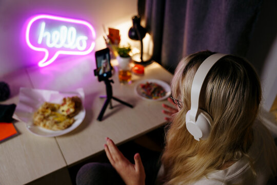Teen girl using smartphone at night