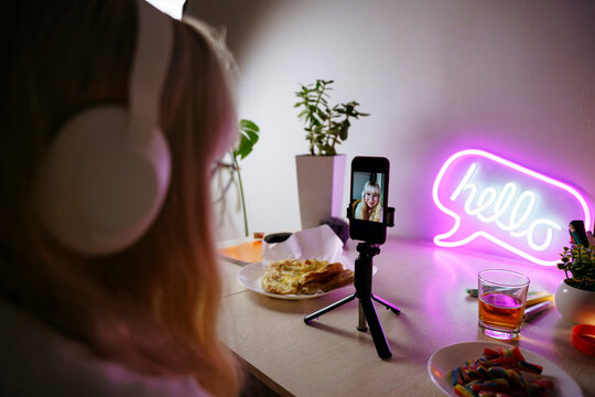Teen girl using smartphone at night