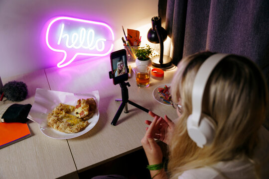 Teen girl using smartphone at night