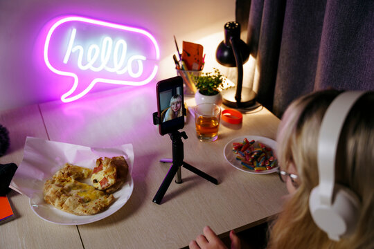 Teen girl using smartphone at night