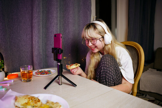 Teen girl using smartphone at night