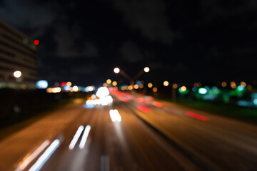 blurry defocused night road. photo of defocused night road. defocused night road and street.