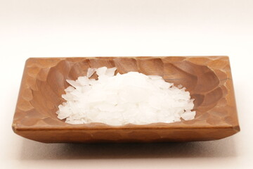 Magnesium chloride detailed closeup on wooden bowl. natural mineral