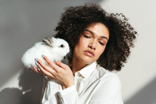Beautiful portrait of woman with rabbit.