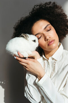 Beautiful mixed-race woman with rabbit.