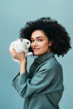 Female portrait with rabbit.