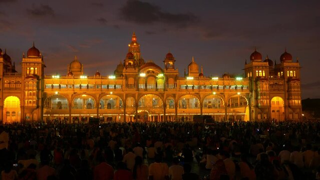 Mysuru, Karnataka, India &mdash; OCT 8, 2022: Mysore Palace (Amba Vilas Palace)  Illuminated at Dusk during the Navaratri Festival (Panning)