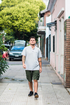 Trans man walking down the street
