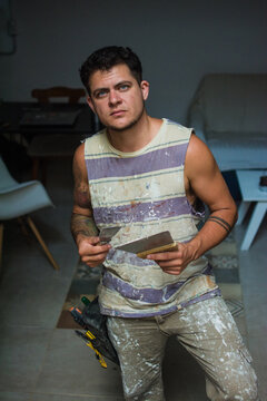 Trans man portrait in working clothes
